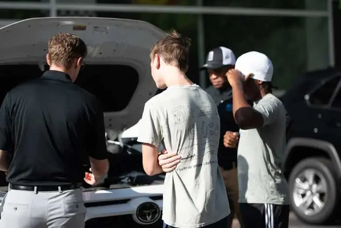Students learning roadside emergency skills